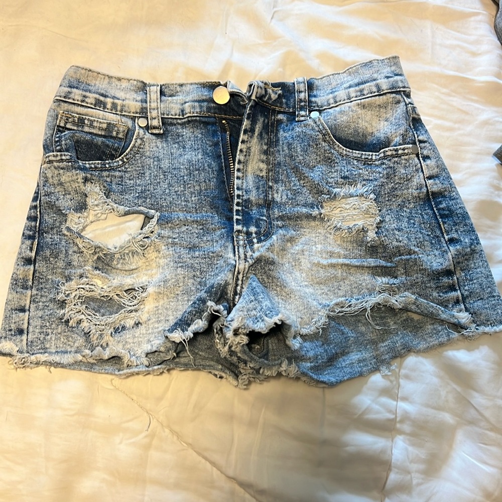 Distressed light blue shorts